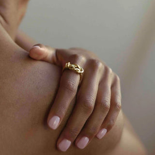 Model wearing a gold plated Double Rope ring by Claire Hibon.