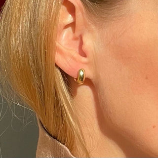EAR HUGGERS chunky huggie hoop earrings, gold-plated