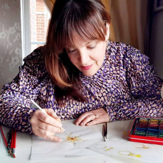 Diana Sherling, founder of Lily Flo Jewellery, sketching designs at her London studio.
