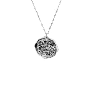 The Empreinte pendant necklace in sterling silver handcrafted by Claire Hibon from reused and recycled material on a white background.