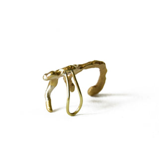 Reverse view of recycled brass monkey cuff earring