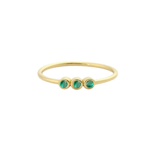 Recycled yellow gold stacking ring with three emeralds in a row