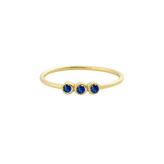 Recycled yellow gold stacking ring with three sapphires in a row