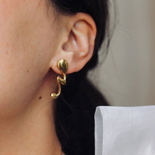 UNCANNY drop earrings, gold-plated