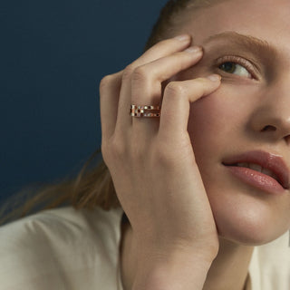 Editorial shoot of model wearing 18ct rose gold vermeil chunky Chichi ring by EDXU