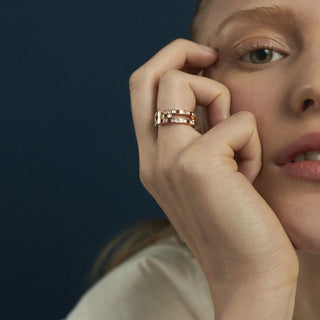 Editorial shoot of model wearing recycled 14ct rose gold statement Chichi ring by EDXU with pink and red gemstones