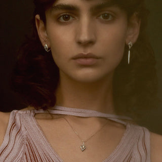 Editorial shoot of model wearing recycled 18ct rose gold and diamond contemporary pendant necklace