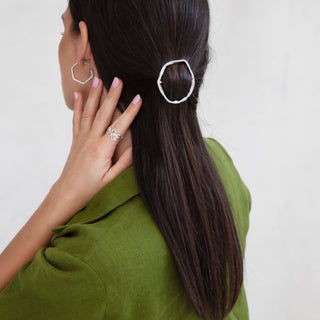 Model wearing sustainable silver jewellery featuring large Portus hoops handmade by Lunaflux.